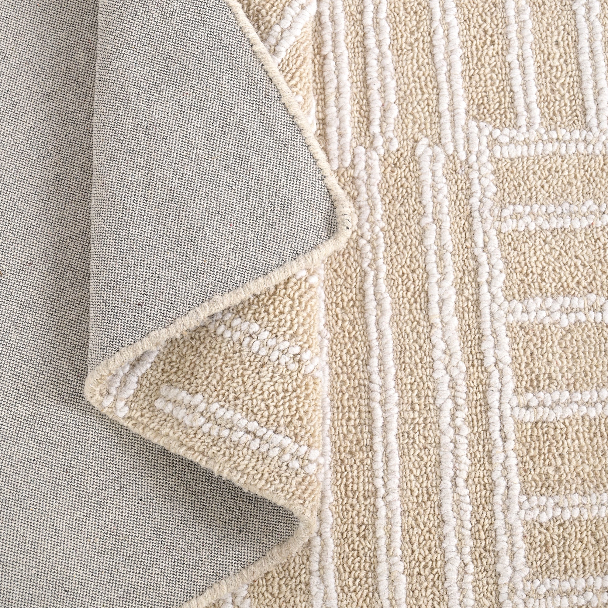 Kubusi Hand Tufted Wool Rug in Ivory (2 Sizes)